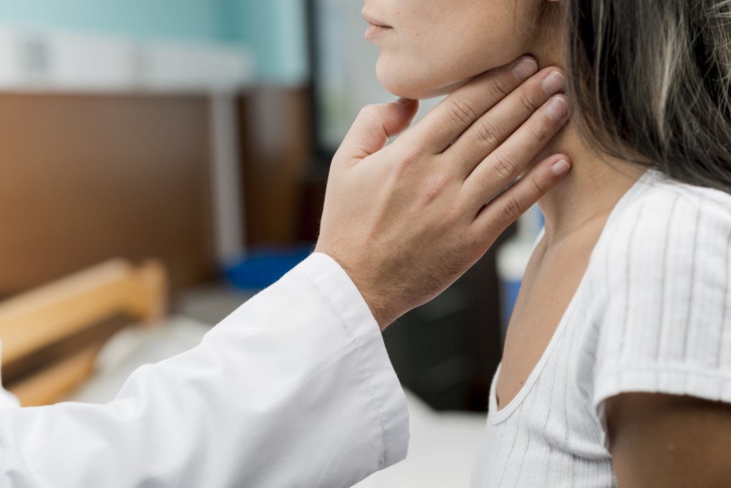 hand-touching-throat-patient.jpg